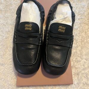 Miu Miu Black Leather Penny Loafers with Gold Logo Accent